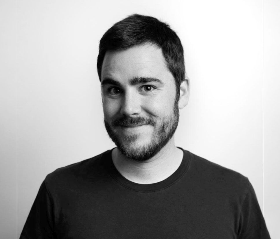 Black and white portrait of Xavier Boluda, smiling.